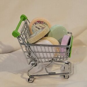 7 Colorful Shower Steamers In A Shopping Cart Basket